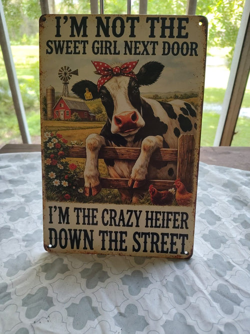 I'm Not the Sweet Girl Next Door, I'm the Crazy Heifer metal sign