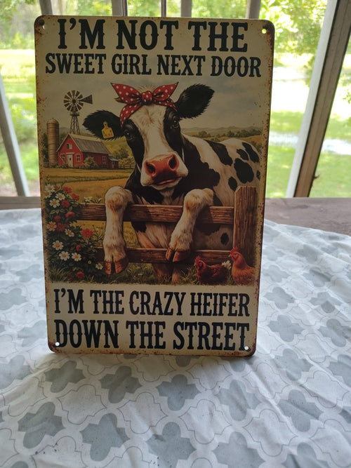 I'm Not the Sweet Girl Next Door, I'm the Crazy Heifer metal sign