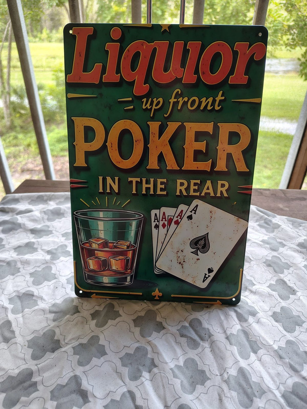 Liquor Up Front, Poker in the Rear metal sign