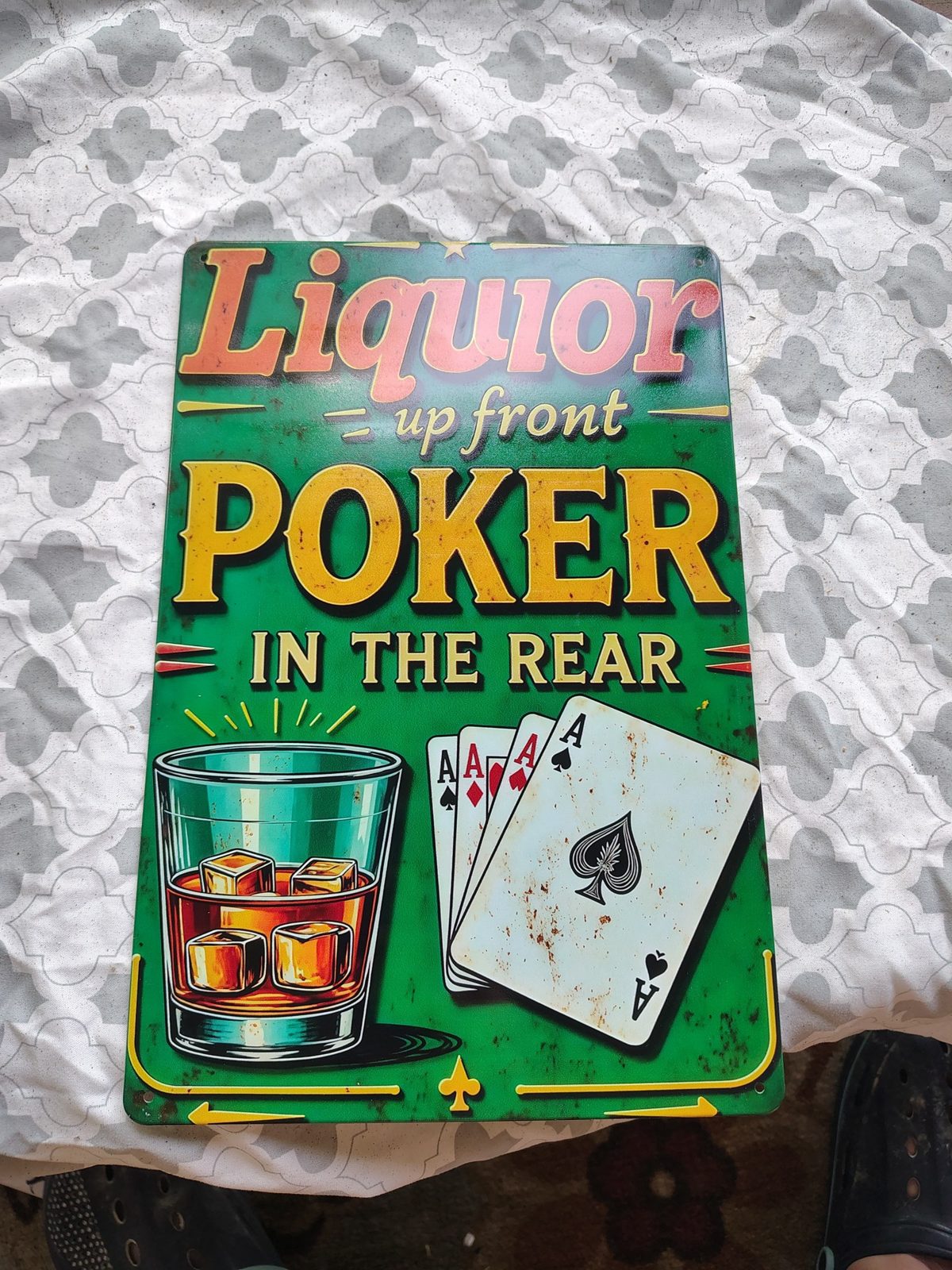 Liquor Up Front, Poker in the Rear metal sign