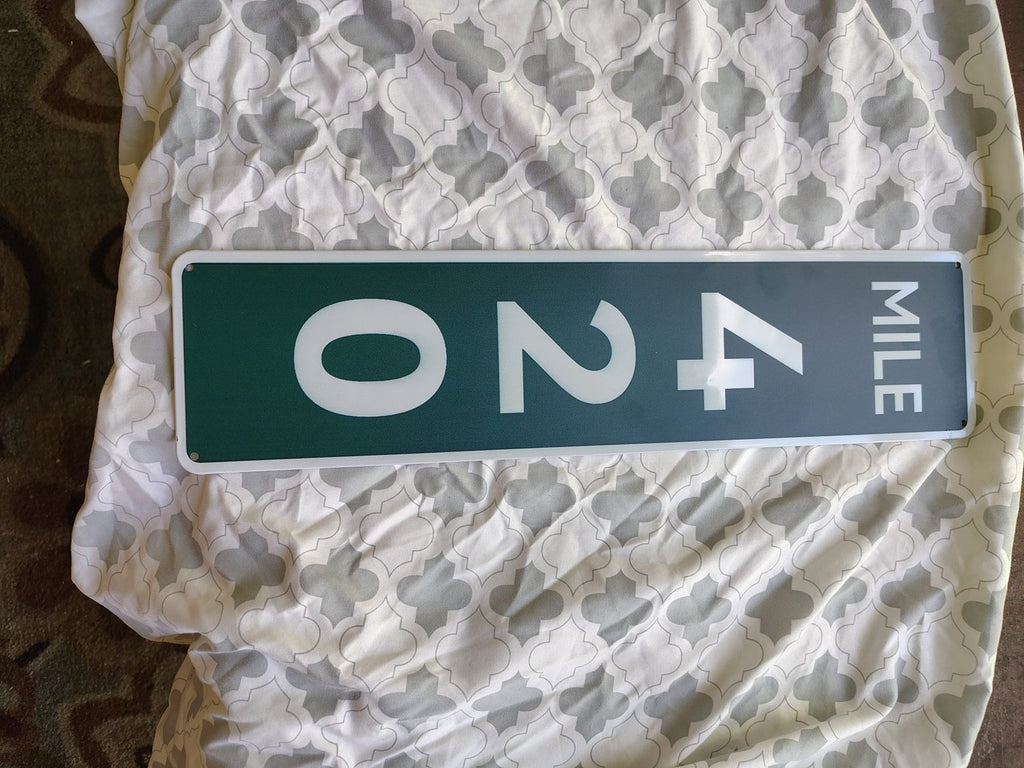 Mile 420 metal sign