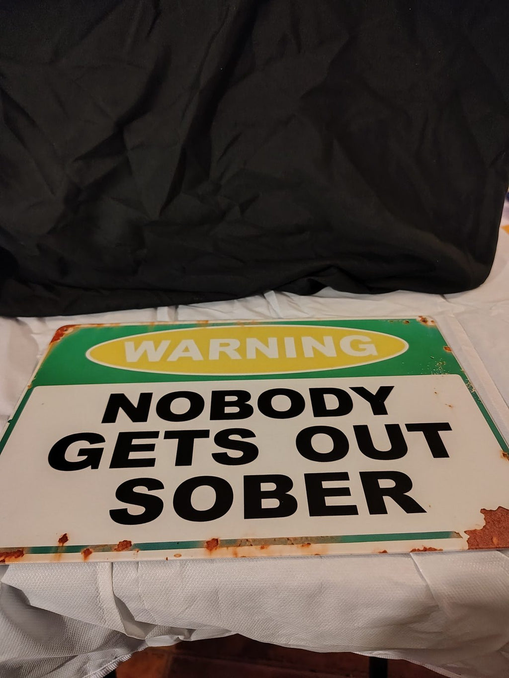 Warning: Nobody Gets Out Sober metal sign