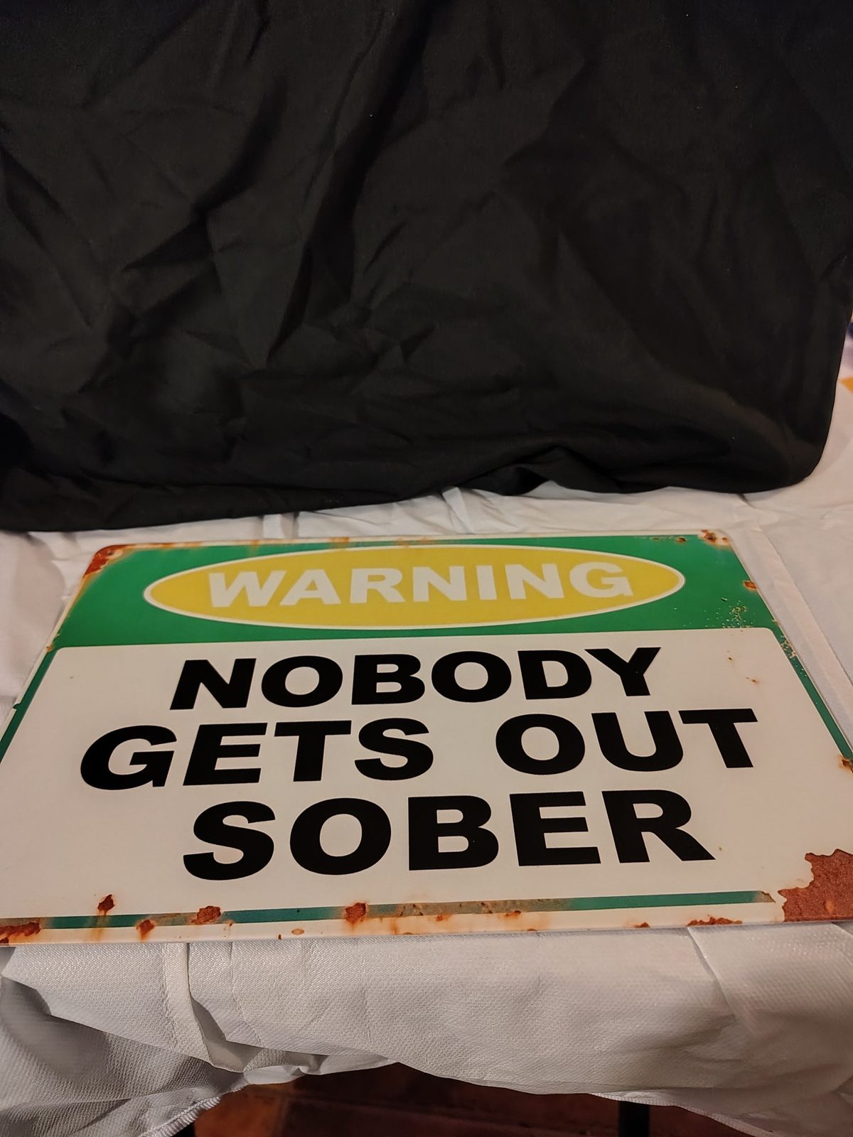 Warning: Nobody Gets Out Sober metal sign