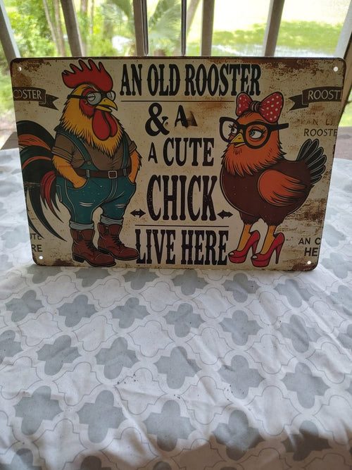 An Old Rooster & A Cute Chick Live Here metal sign