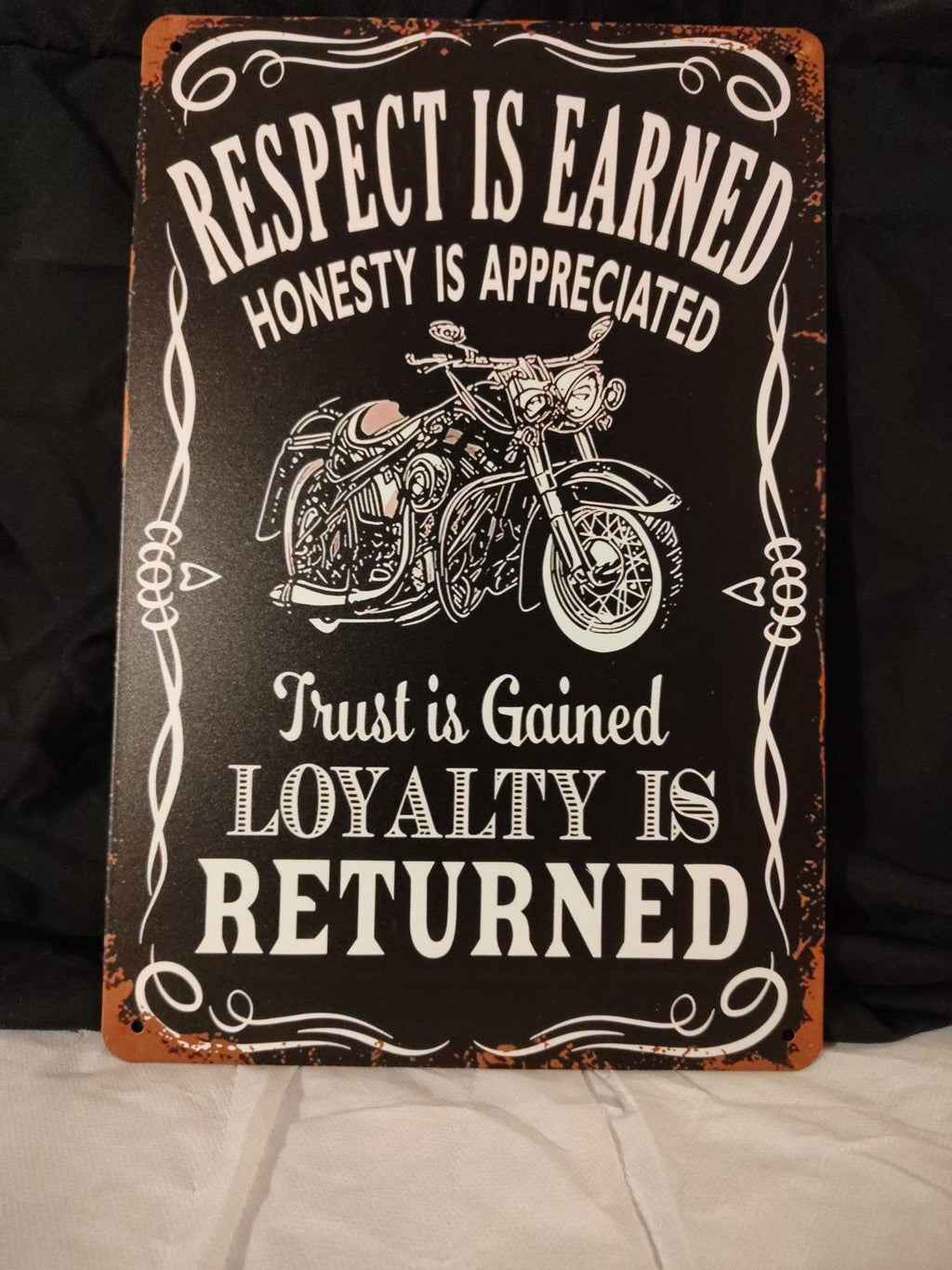 Respect Is Earned, Loyalty Is Returned metal sign