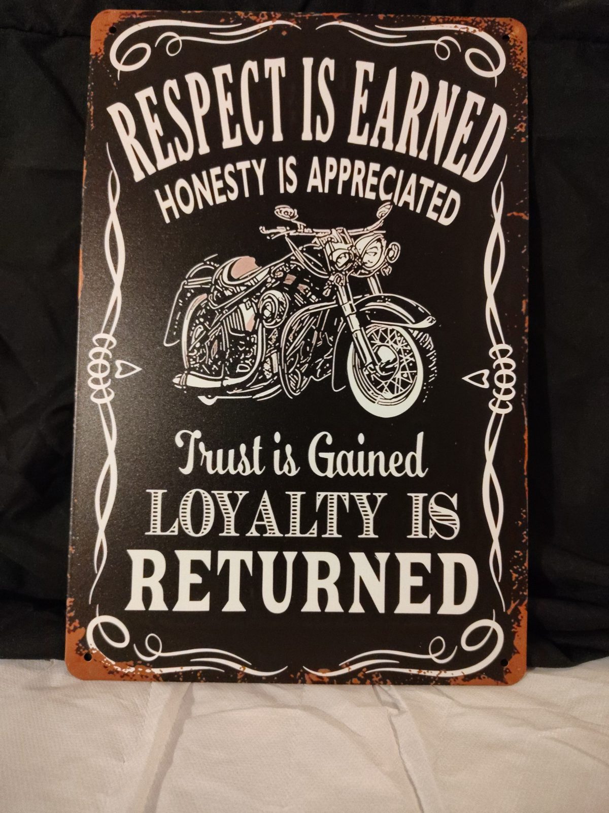 Respect Is Earned, Loyalty Is Returned metal sign
