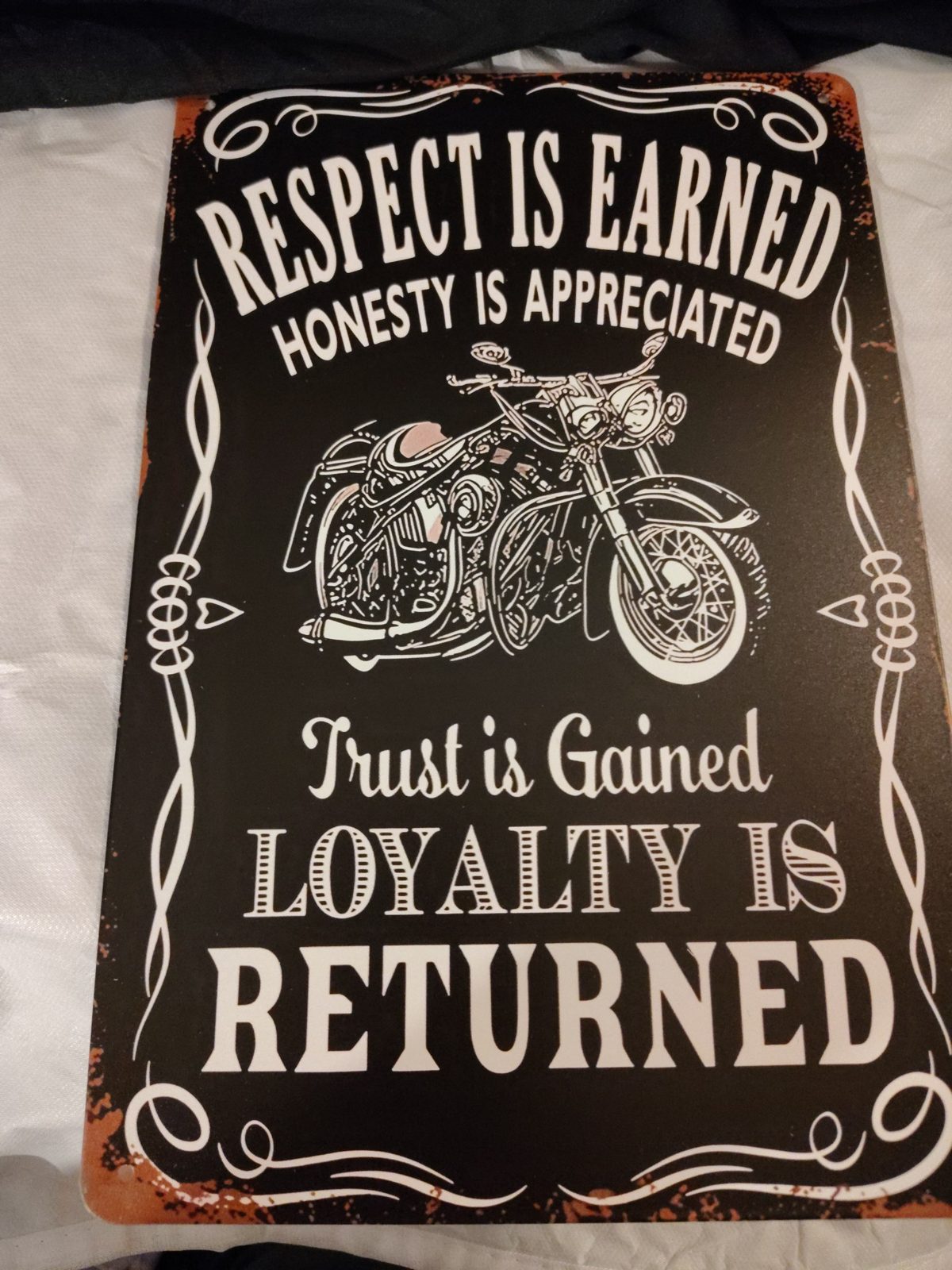 Respect Is Earned, Loyalty Is Returned metal sign