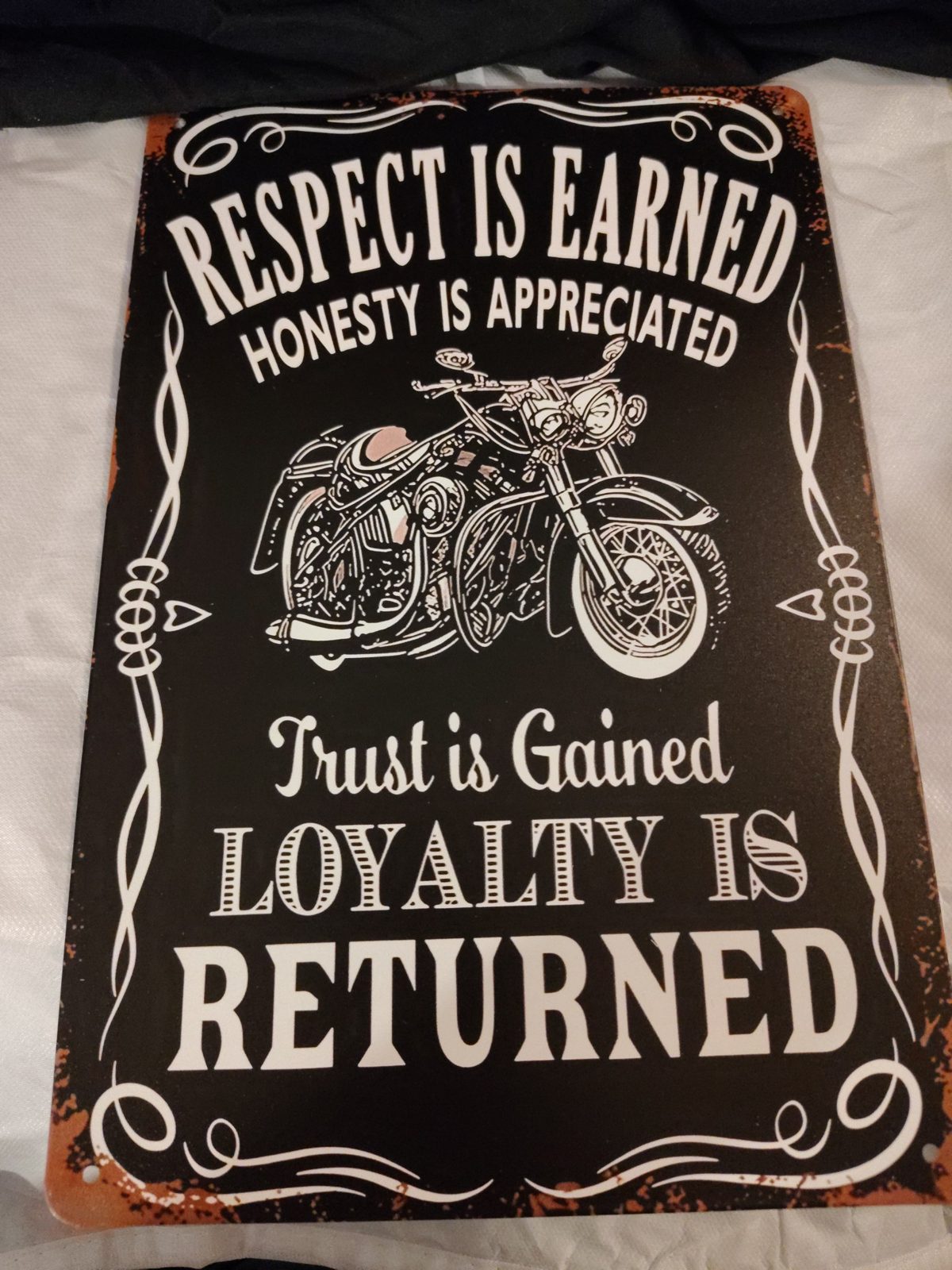 Respect Is Earned, Loyalty Is Returned metal sign