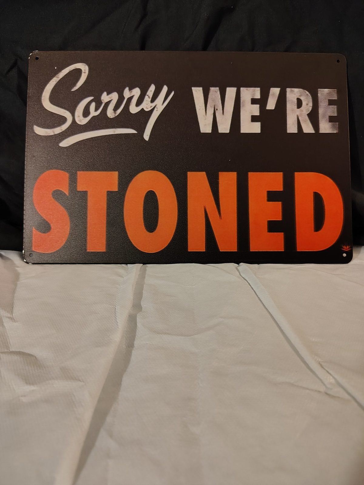 Sorry We're Stoned metal sign