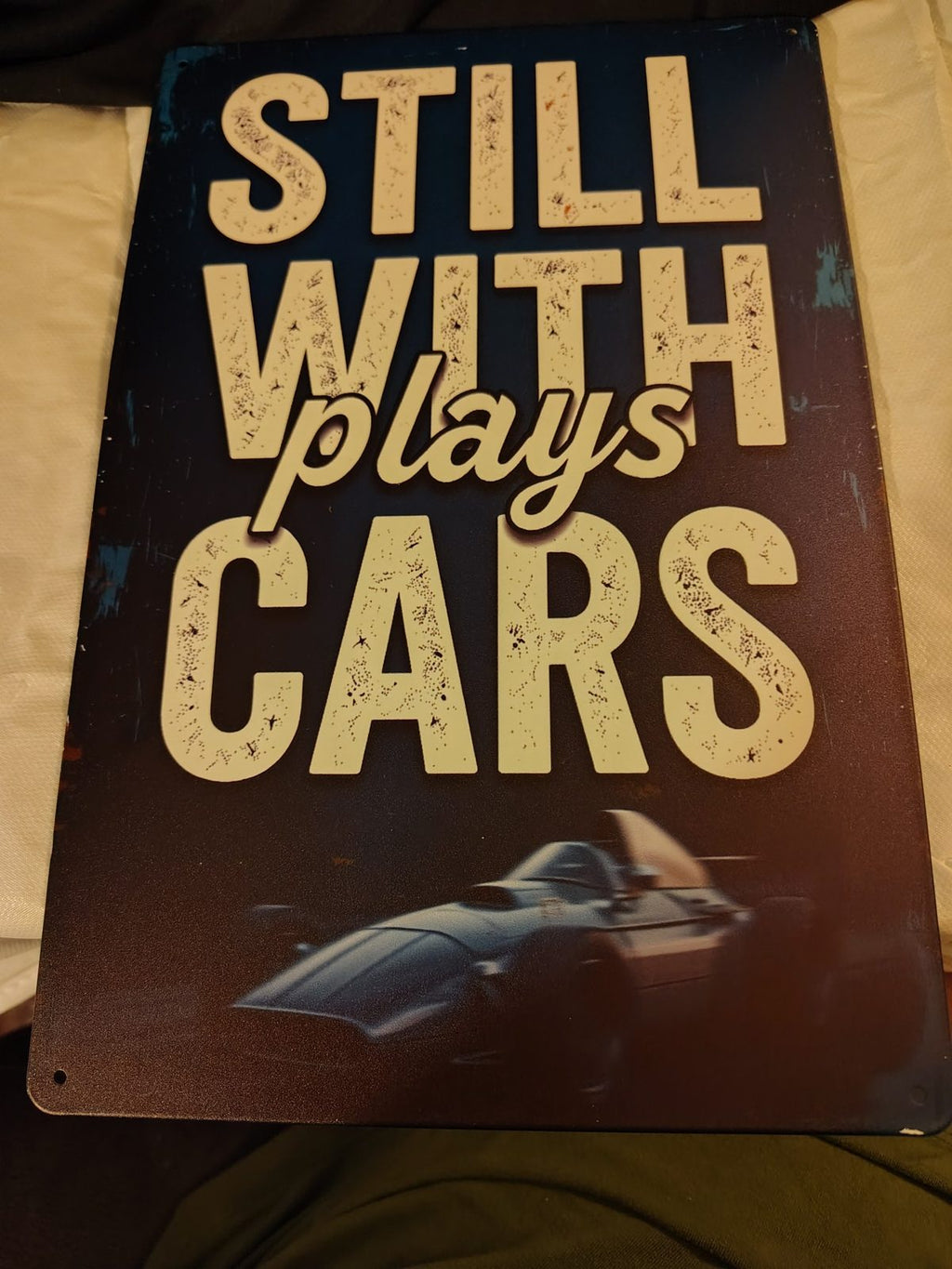 Still Plays With Cars metal sign