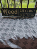 Weed City Limit metal sign