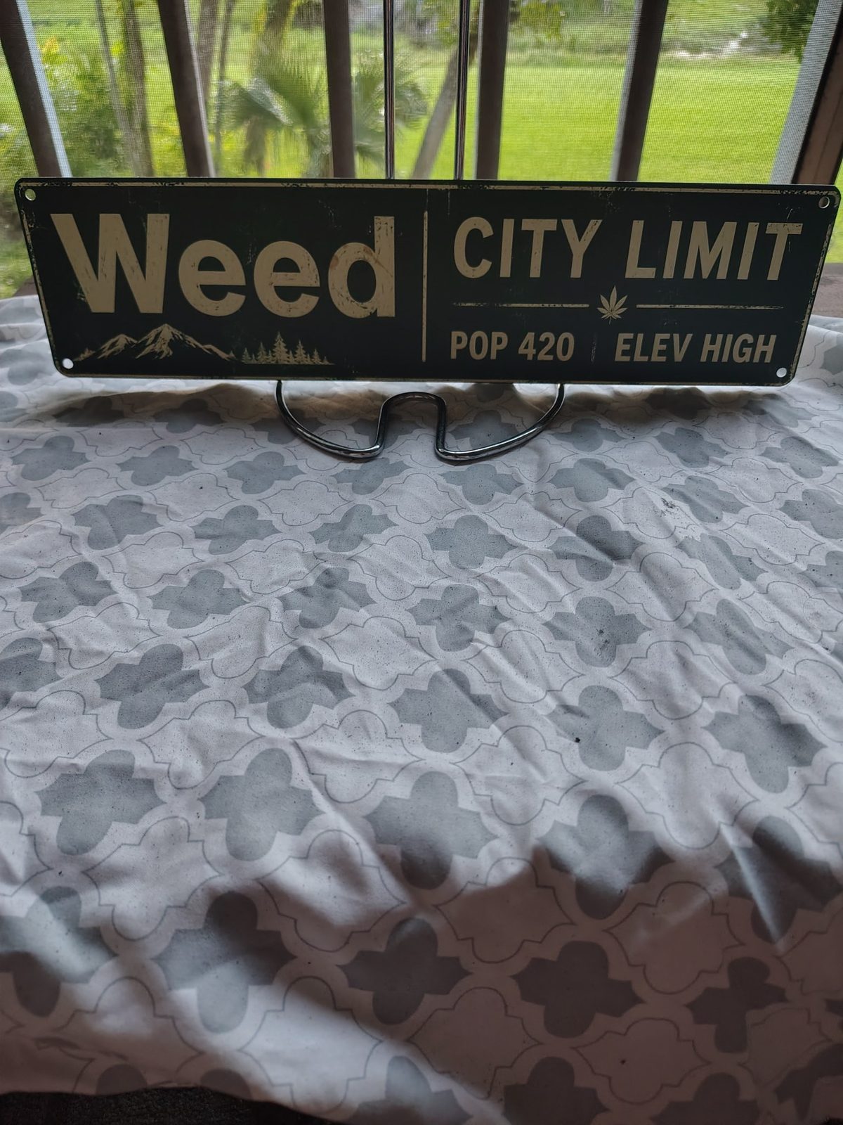Weed City Limit metal sign