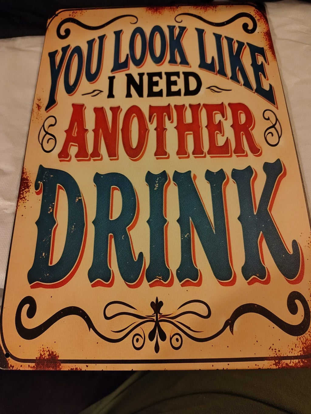 You Look Like I Need Another Drink metal sign